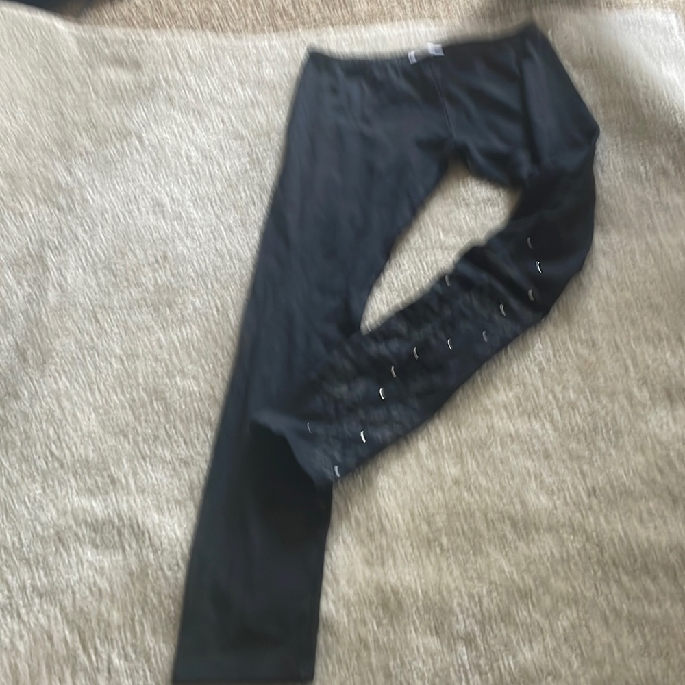 Young girls, black leggings, brand, new styling and patent on the right leg.